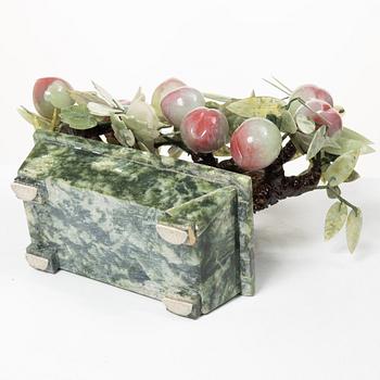 A stone table decoration in the shape of a peach tree, China, 20th century.