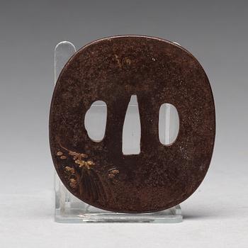 A Japanese bronze Tsuba, Edo period (1603-1868).