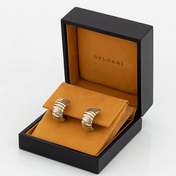 A pair of Bulgari "Tubogas" earrings in 18K gold and steel.