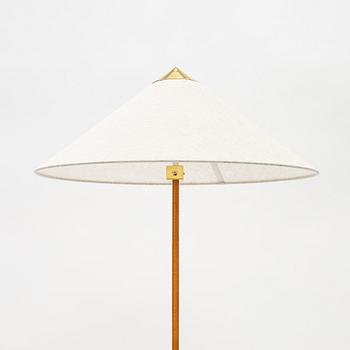 Paavo Tynell, A model 9602 brass and rattan floor lamp with canvas shade from Gubi,