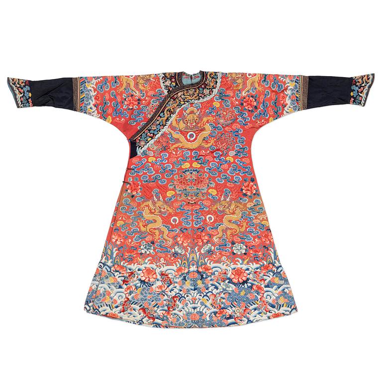 An embroidered red ground five clawed dragon 'female' formal robe, Qing dynasty, 19th century.