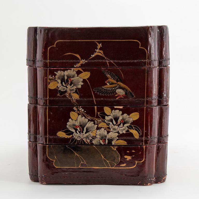 A painted Japanese four tiered box, 20th Century.