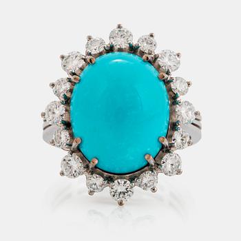 991. An 18K white gold ring set with a cabochon-cut turquoise and round brilliant-cut diamonds.