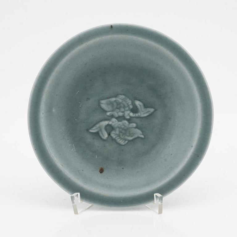 A celadon dish, for the south east asian market, double fish, Mingstyle, 20th Century. And a Chinese sealstone.