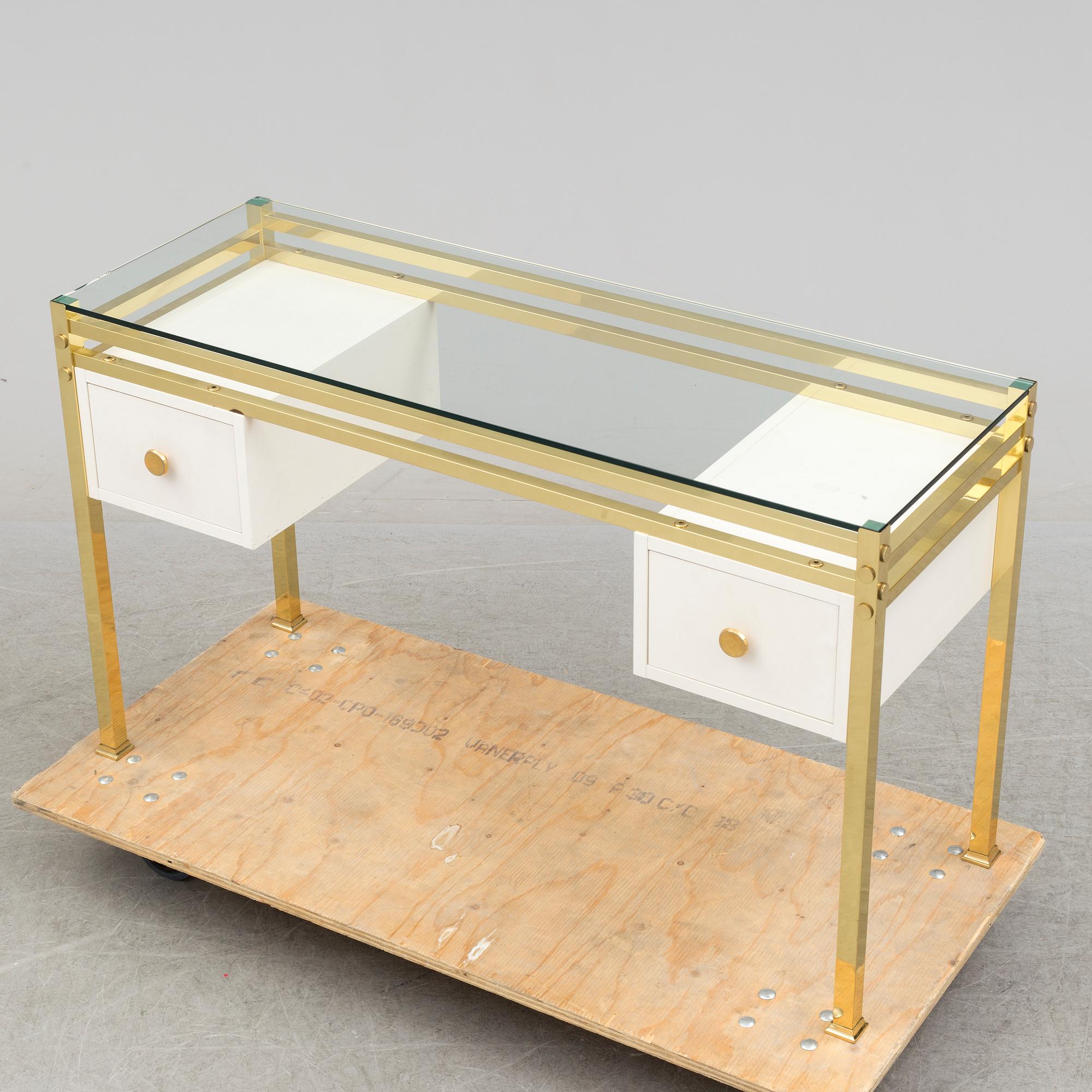 A 1980's dressing table with glasstop.