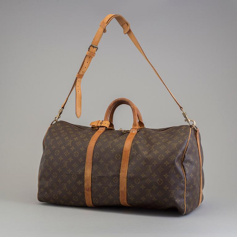 A Keepall Bandouliere 55 WEEKEND BAG by Louis Vuitton.