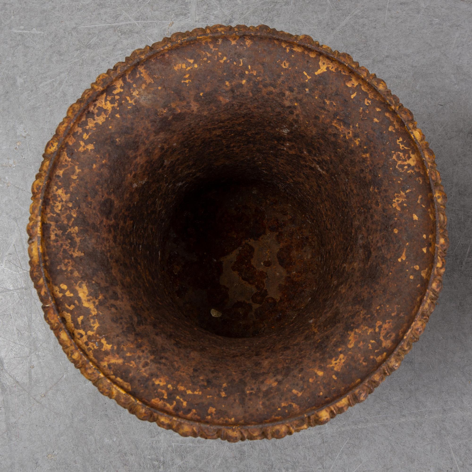 Two 19th century cast iron urns.