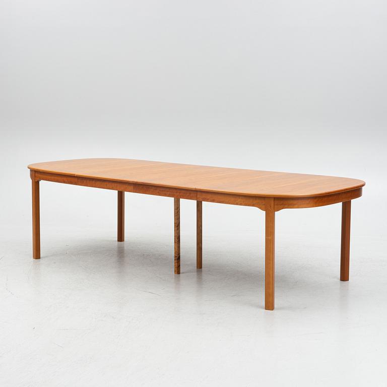 Carl Malmsten, a model "Ambassadör" dining table with ten chairs, Sweden, second half of the 20th century.