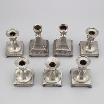 7 pewter candlesticks, 19th Century. (2+2+2+1).