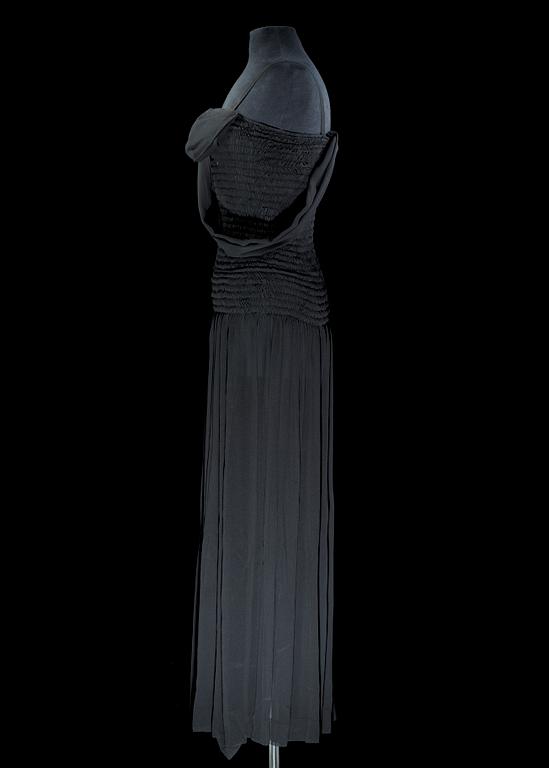 A black silk long dress by Yves Saint Laurent.