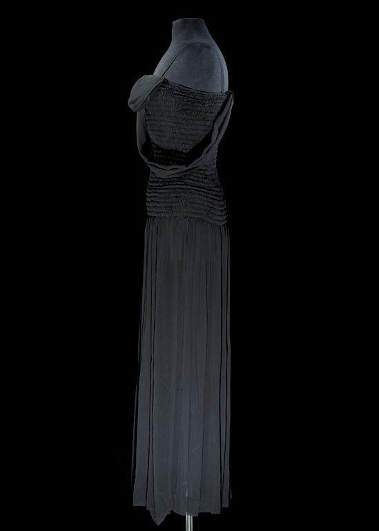 A black silk long dress by Yves Saint Laurent.