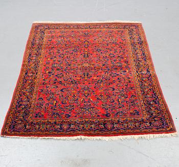 A rug, a semi-antique Kashan, ca 210 x 130,5-134 cm.