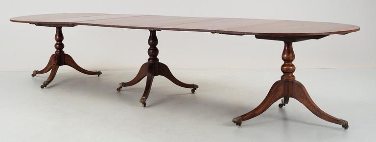 An English Regency and later mahogany dining table.