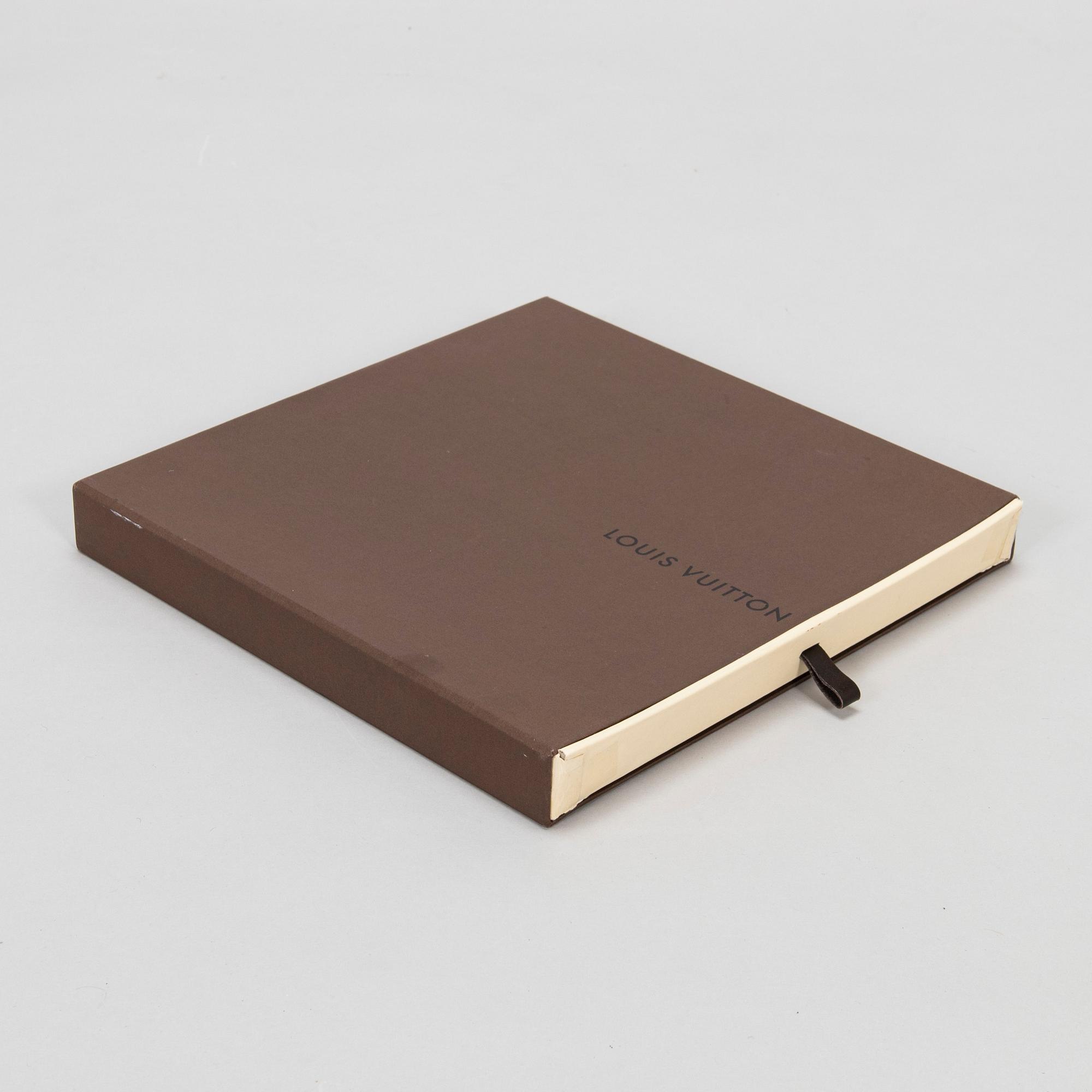 Louis Vuitton, a silk scarf.