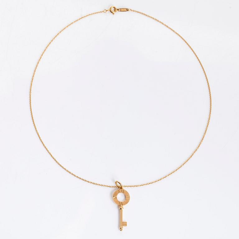Tiffany & Co, an 18K gold 'Atlas Key' pendant with chain.