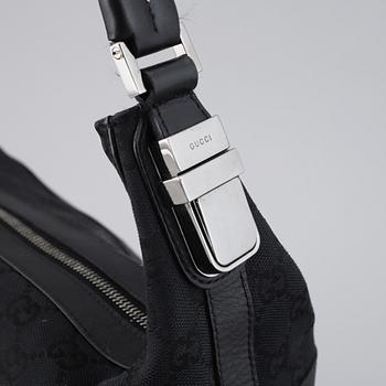 GUCCI, a canvas and leather bag.