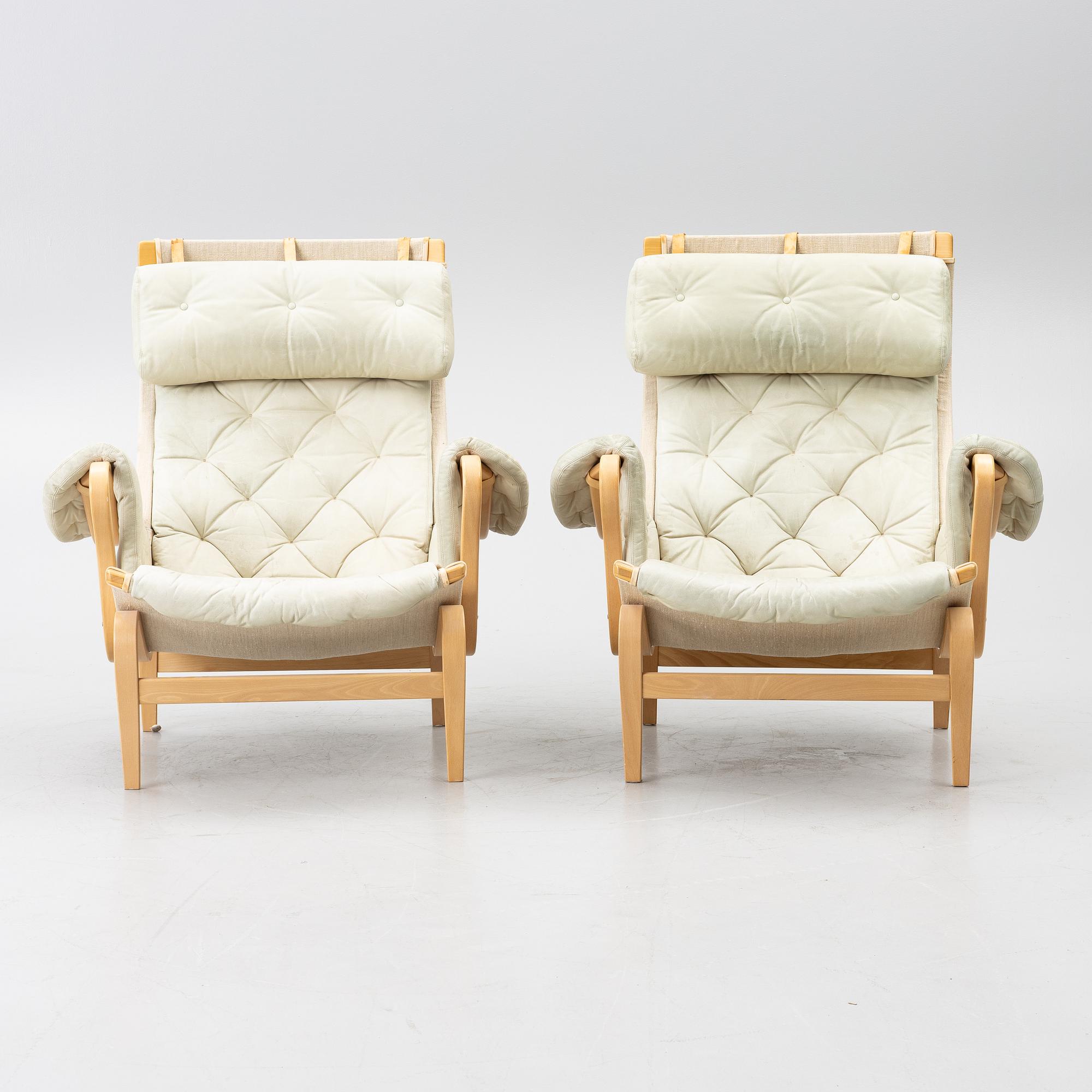 Bruno Mathsson, a pair of 'Pernilla' armchairs, Dux, Sweden, later part of the 20th century.