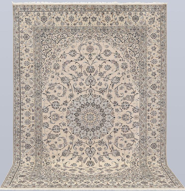 A Nain, part silk carpet, 305 x 207 cm.