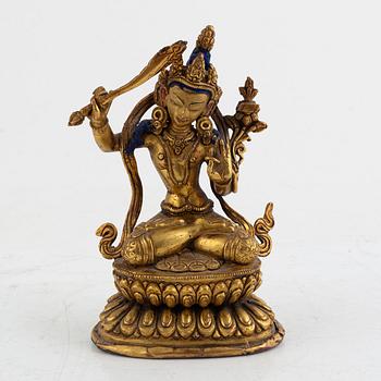 A gilt bronze figure of Manjushri, 20th century.