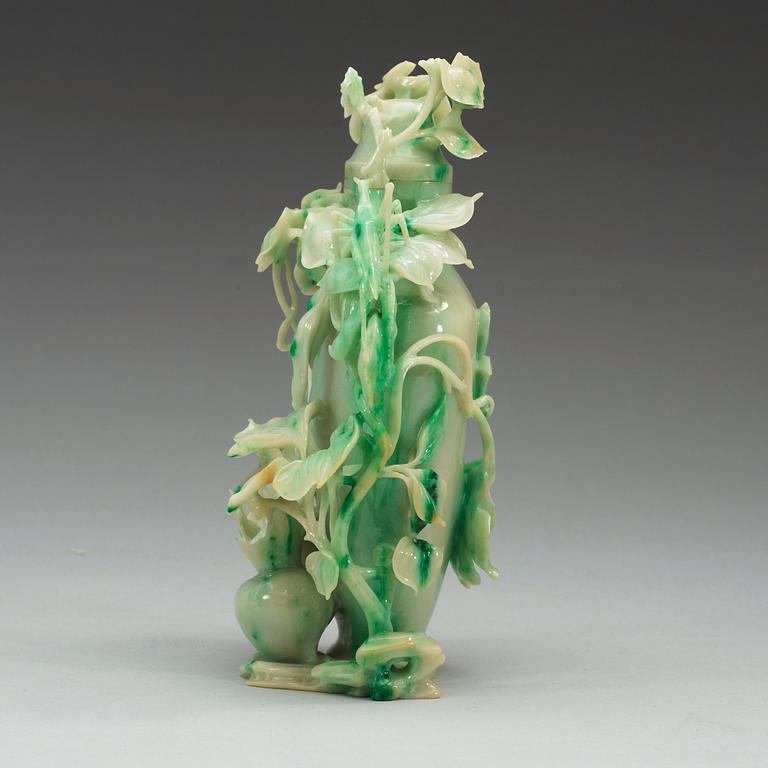 A Chinese elaborately carved nephrite vase with cover, 20th Century.