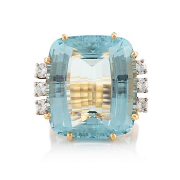 503. A ring in 18K gold with a step-cut aquamarine and round brilliant-cut diamonds by Gunnar Fahlström.