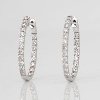 A pair of ovale diamond, 1.38 cts according to engraving, loop earrings.