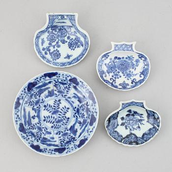 A set of 3 blue and white butter shells and a dish, Qing dynasty, 18th Century. The small dish 19th Century.