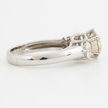 Fancy light yellowish brown round brilliant-cut diamond ring.
