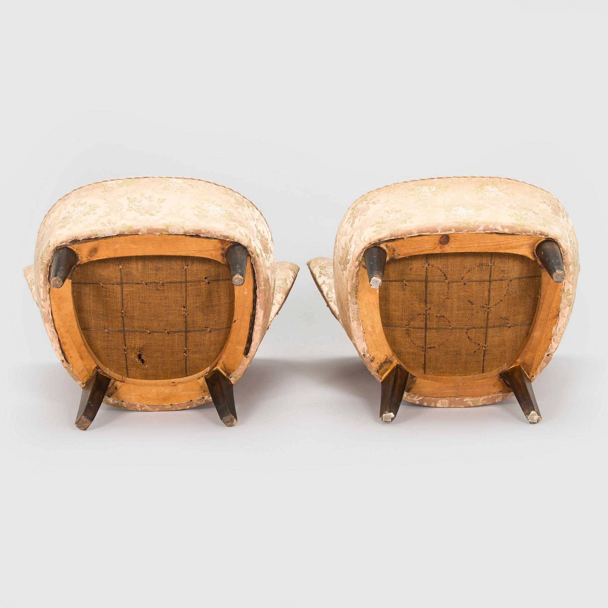A pair of mid-20th century armchairs.