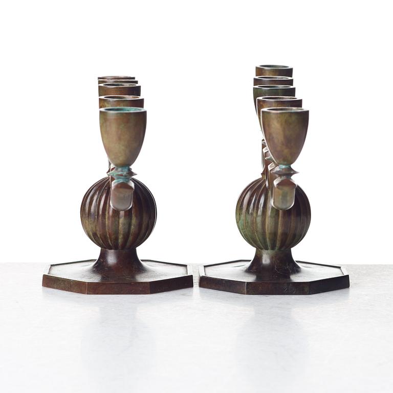 GULDSMEDSAKTIEBOLAGET (GAB), a pair of Swedish Grace patinated bronze candelabra, Stockholm 1930's.