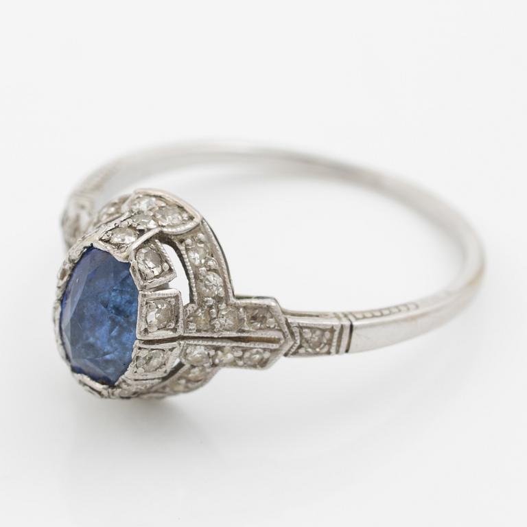 Ring 14K gold with a synthetic blue stone and small diamonds and white stones.