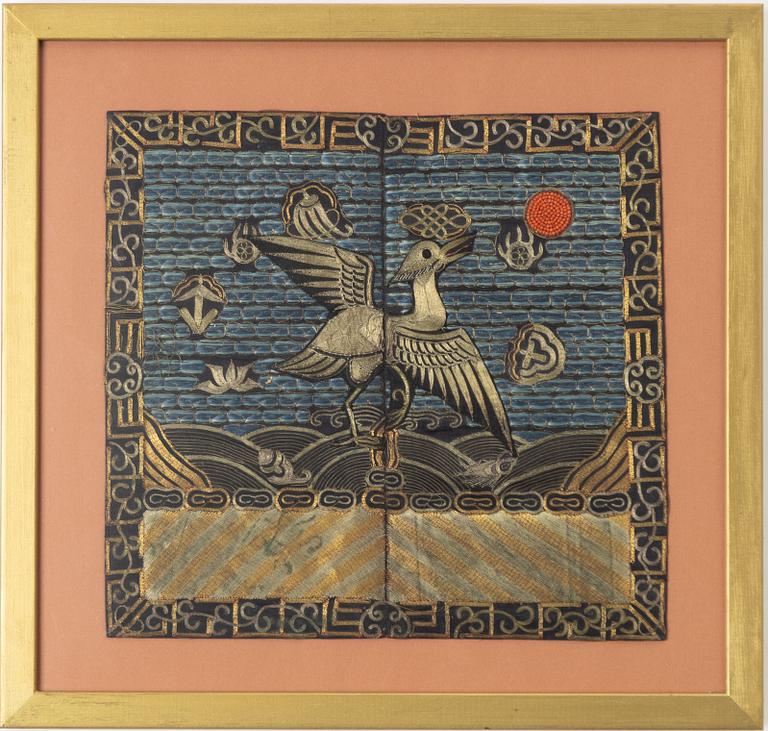 An embroided silk and metal thread rank badge of a crane, Qing dynasty, 19th century.