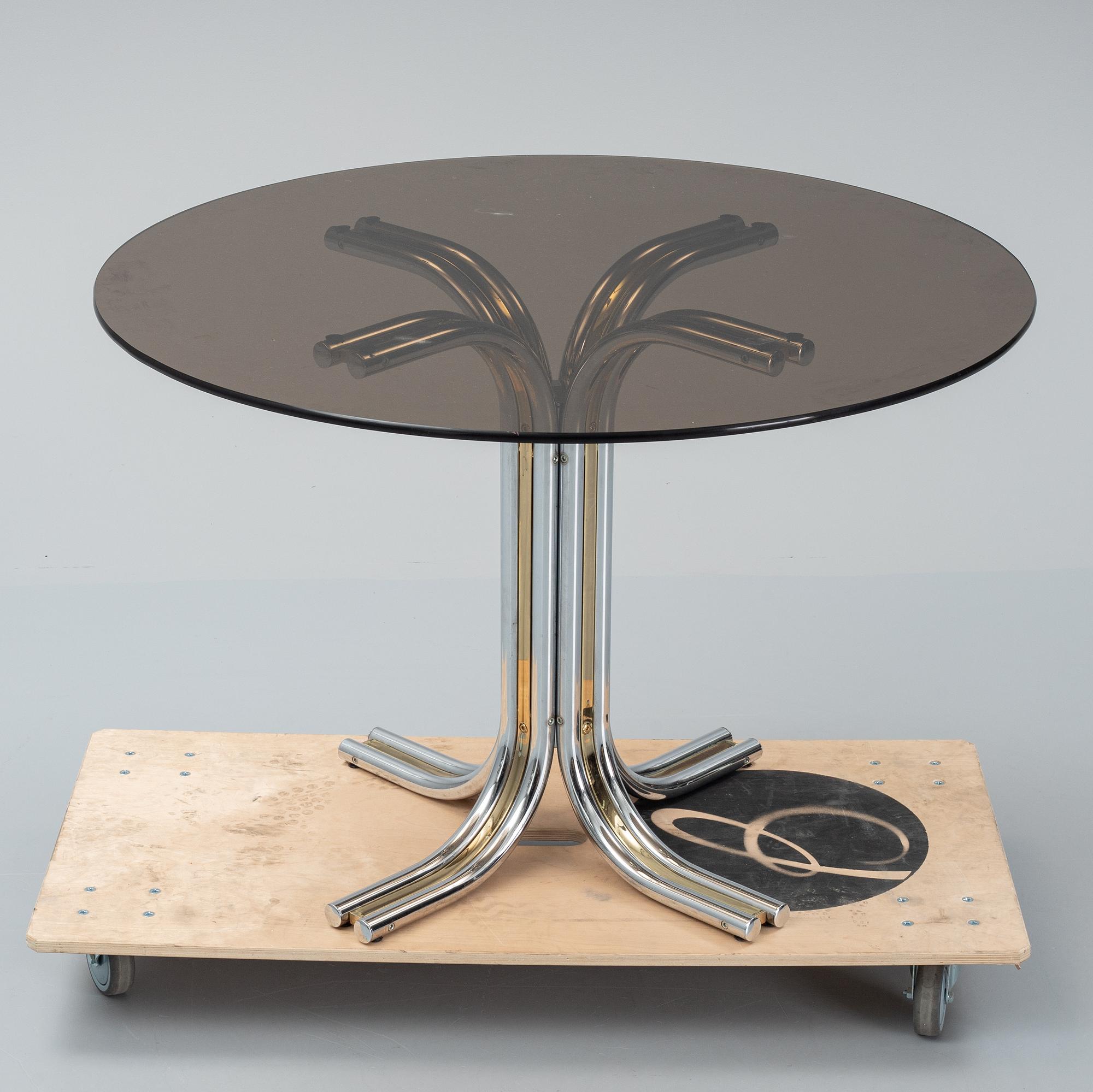 An iIalian glass top dining table, 1970's/80's.