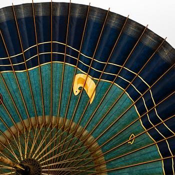 A set of six fans and two umbrellas and a wig/pony tail. Japan, early 20th Century.