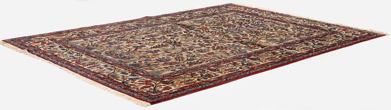 A semi-antique Qum carpet, Central Persia, c. 312 x 215 cm.