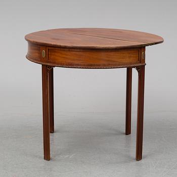 An early 19th Century round mahogany card table.