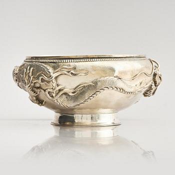 A Chinese double walled 'dragon' silver bowl, Shanghai, around 1900.