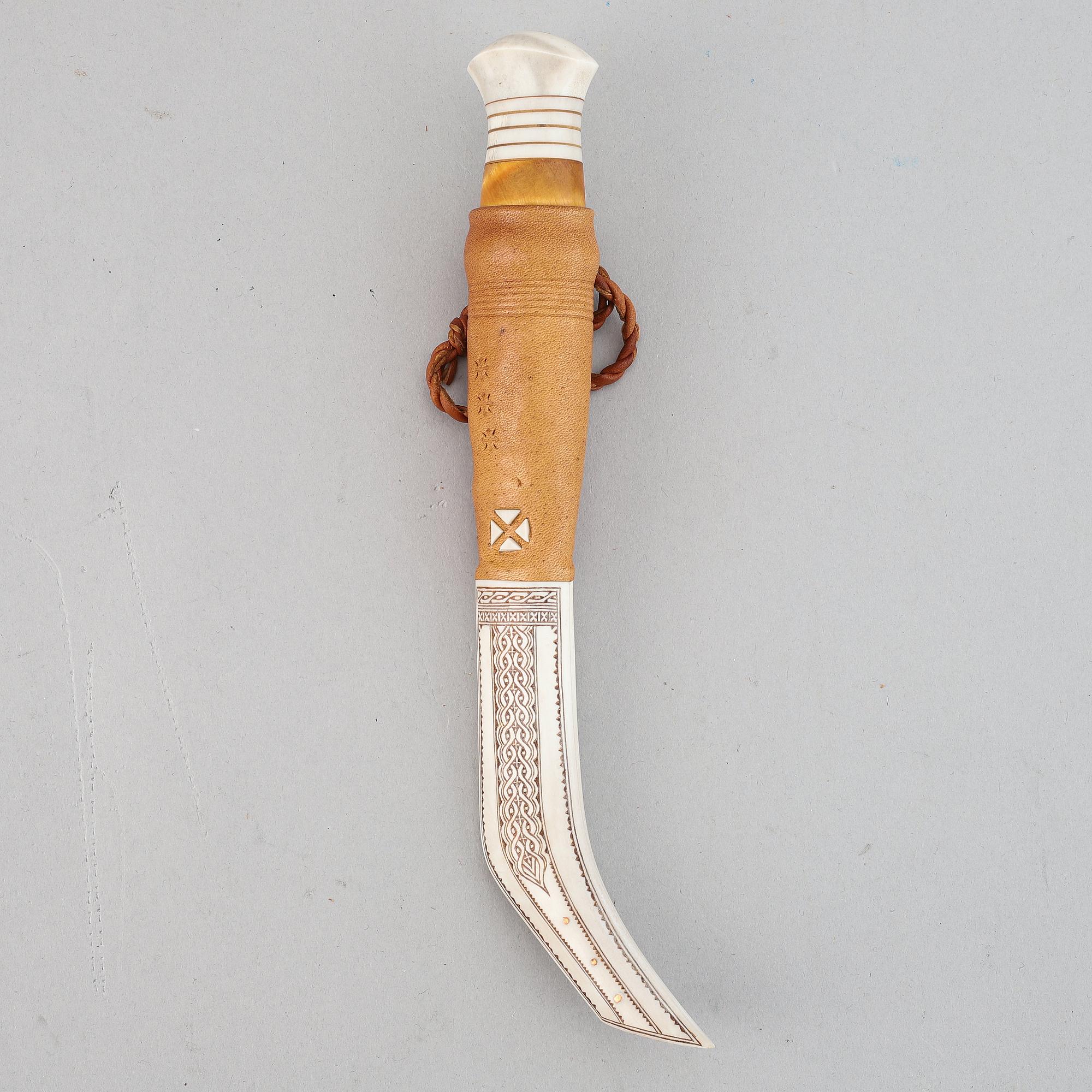 Lennart Sammelin, a reindeer horn, birch and leather Sami knife, signed LS.