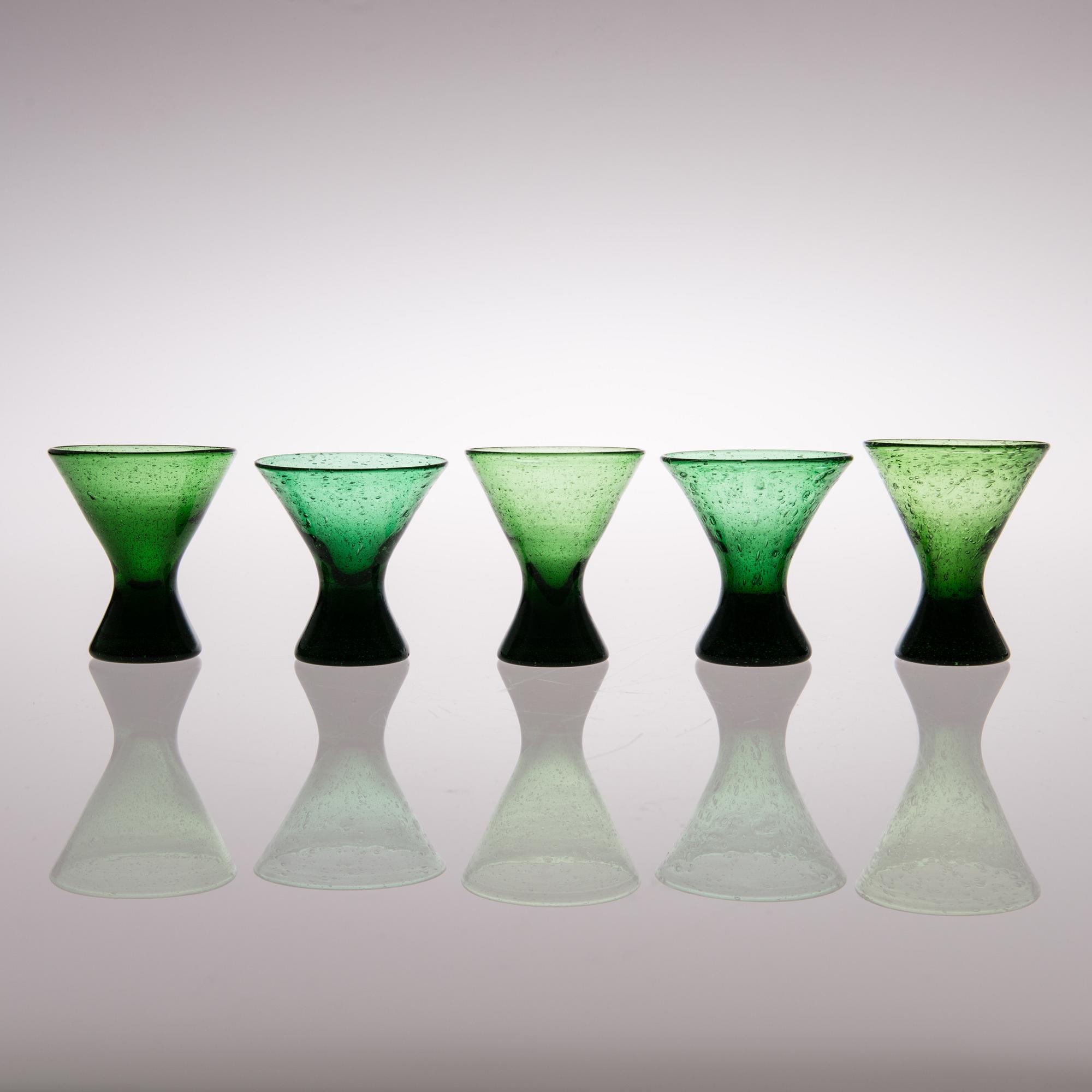 A set of ten "Vähän vino" (Slightly crooked) glasses, manufactured by Karhula in the 1930s.