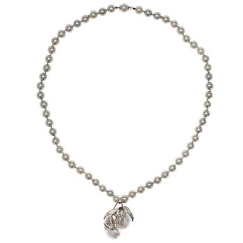 A NECKLACE, 18K white gold, akoya pearls 7 mm and 2 large baroque south sea pearls.