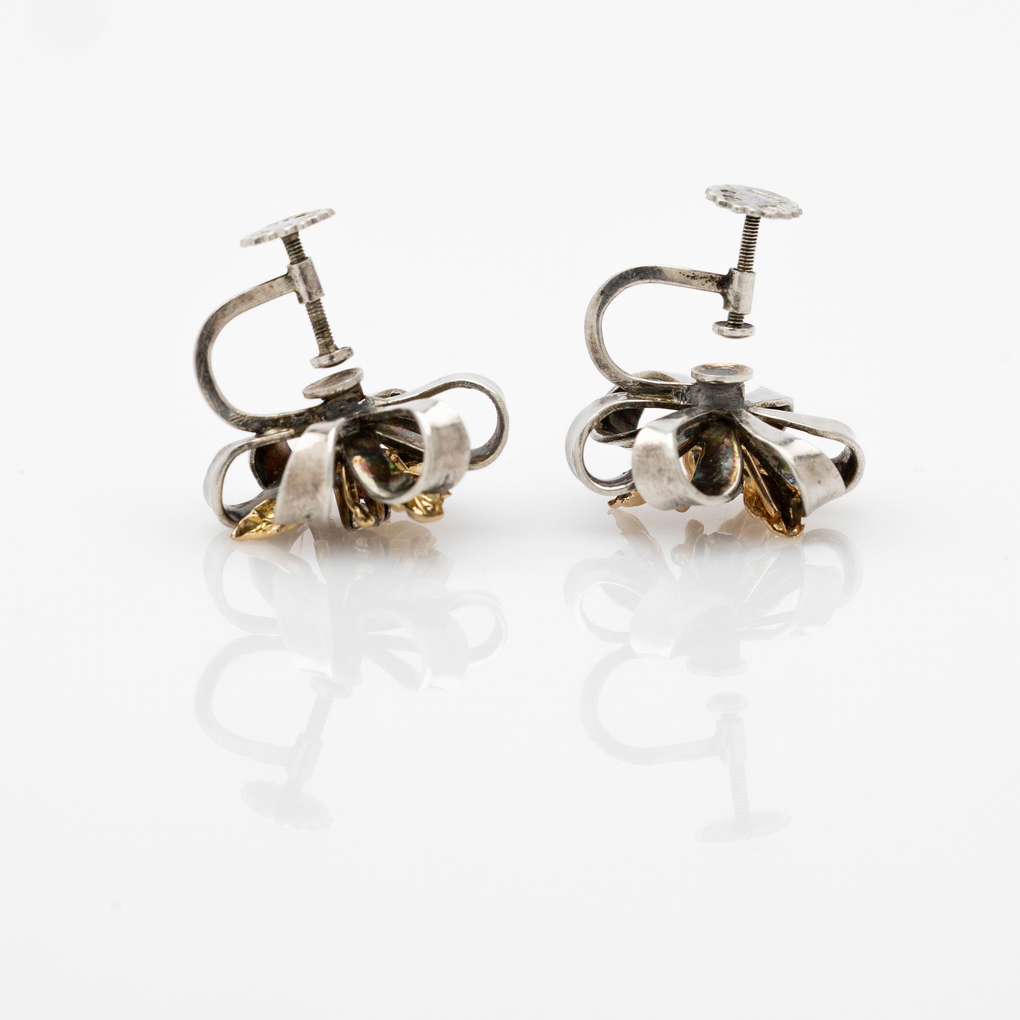 Earrings, a pair, silver and 14k gold with brilliant-cut diamond.