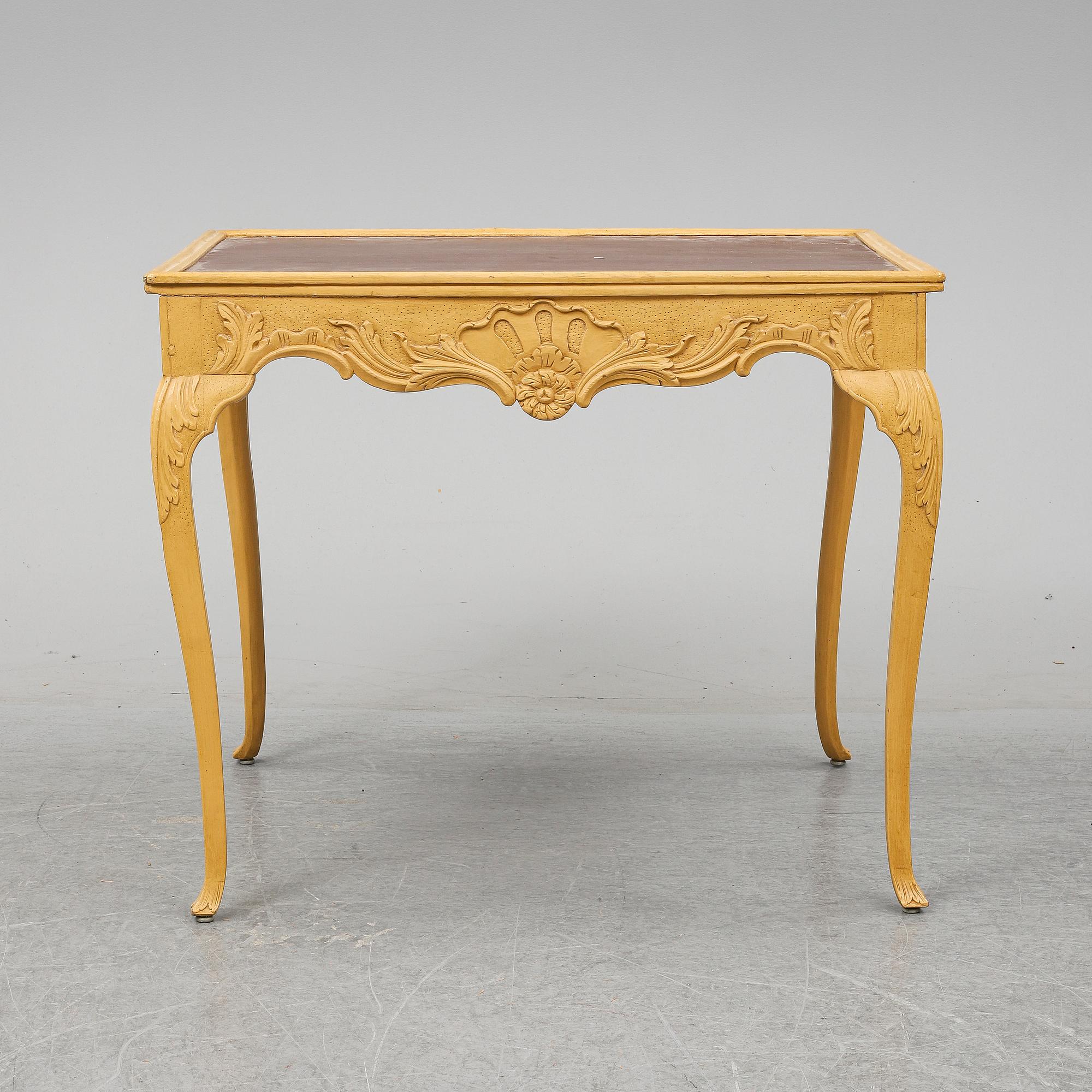 A presumably rococo style 19th century table.