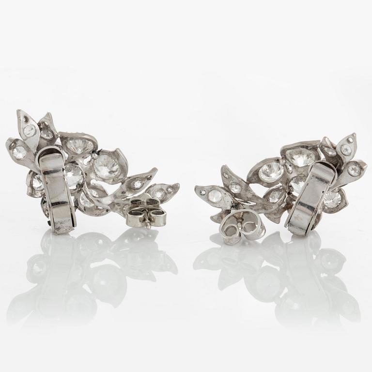 A pair of earrings set with old-cut diamonds.