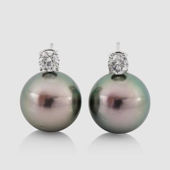 1110. A pair of cultured Tahiti pearl, 14.5 mm, and diamond, 0.95 ct, earrings.