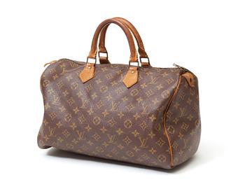 583. A 1980s monogram canvas handbag by Louis Vuitton, "Speedy".