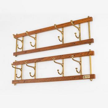 A pair of 'Dekorativ' coat hangers, Skoglunds metallgjuteri, Anderstorp, mid 20th Century.