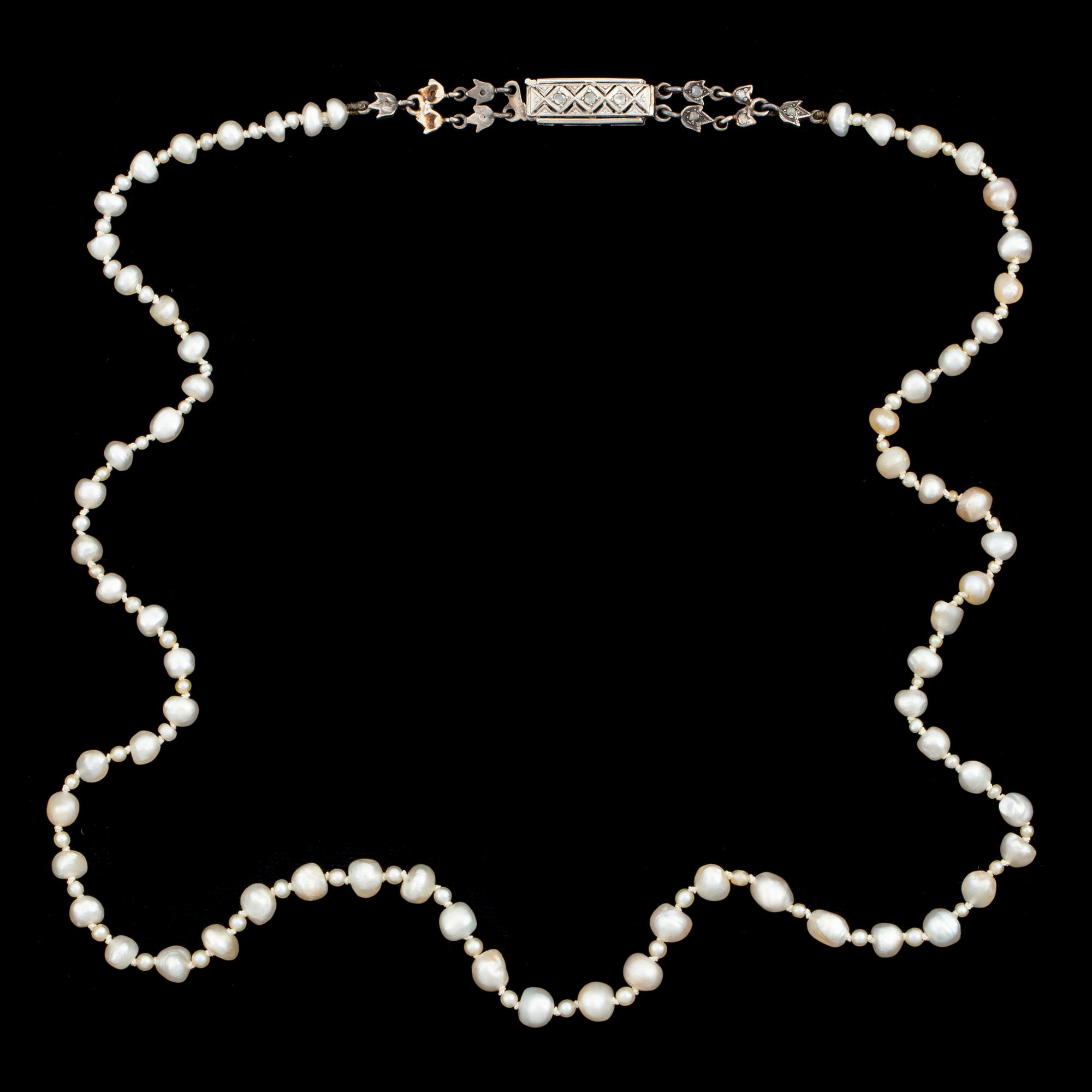 Pearl necklace, clasp with rose cut diamonds.