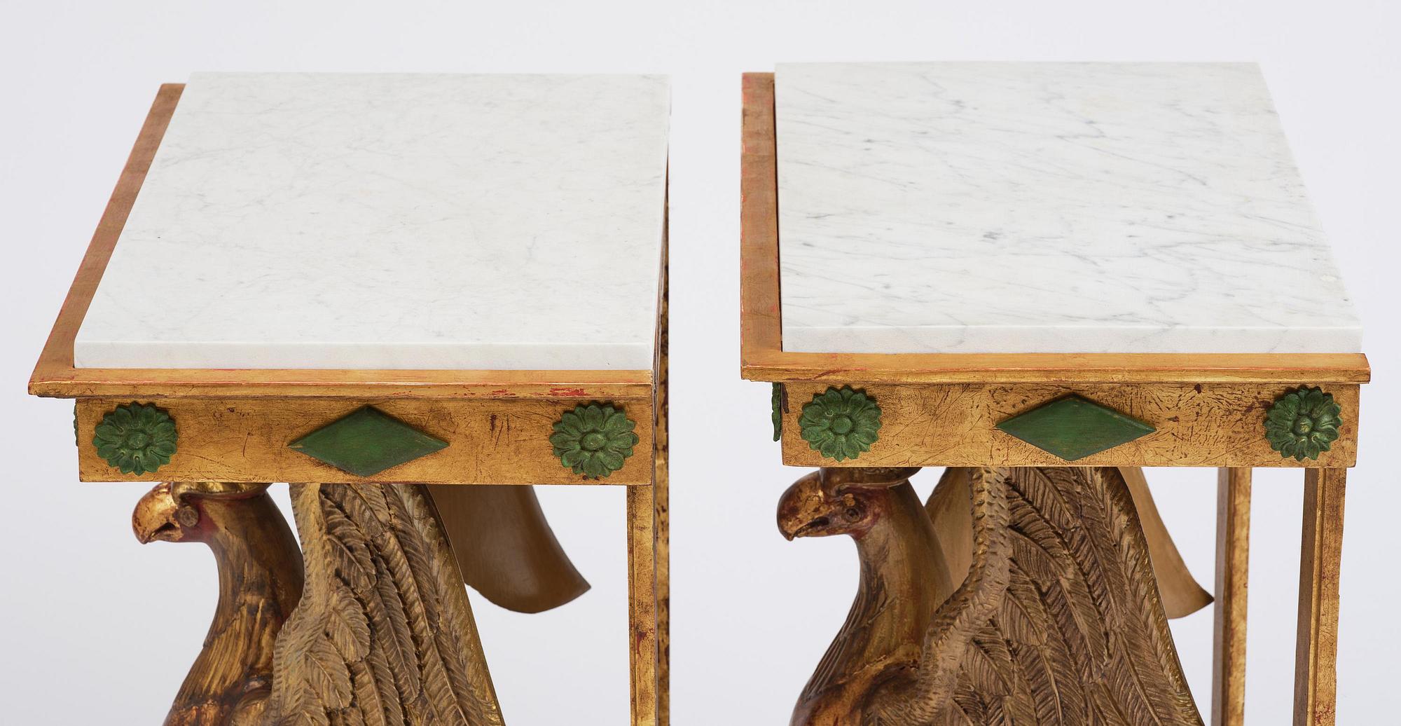 A pair of giltwood console tables, Empire-style incorporating older elements.