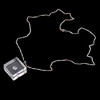 A glass pendant designed by Gunnar Cyrén and a silver necklace.