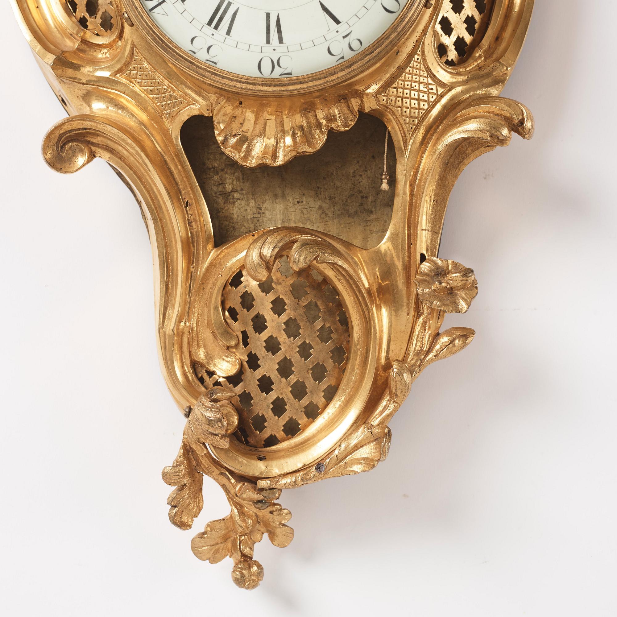 A French Louis XV ormolu cartel clock marked Baudin à Paris, mid 18th century.